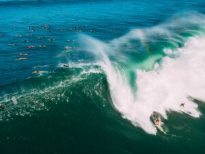 people surfing on sea waves